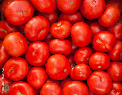 Red tomatoes background © romankrykh