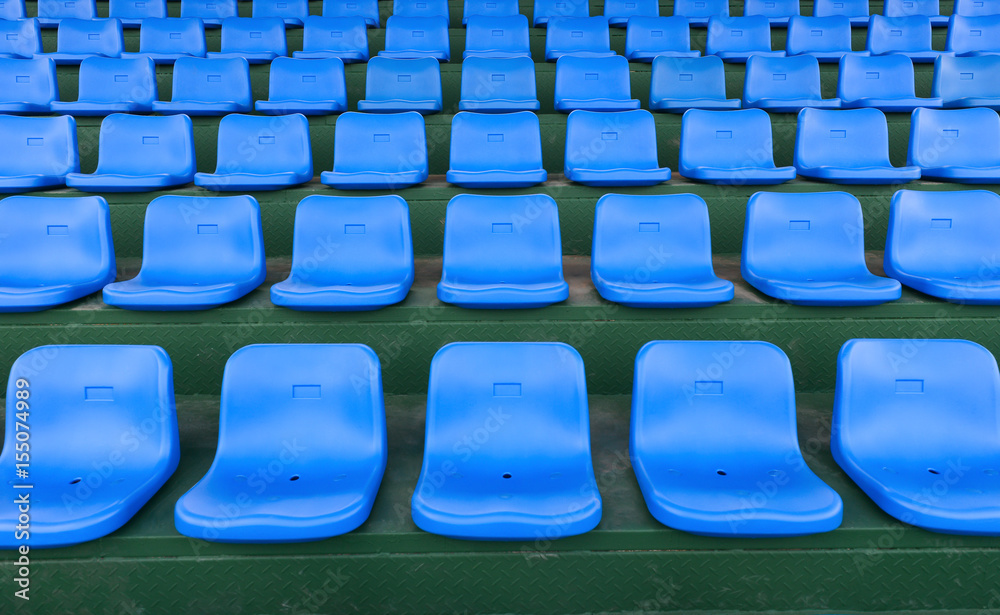 Fototapeta premium lines of blue stadium seats horizontal composition