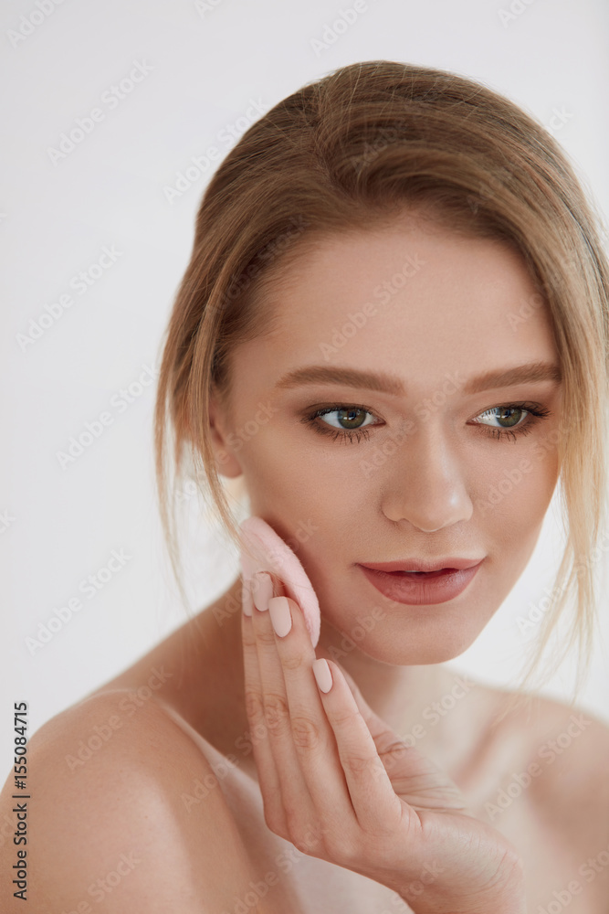 Face Beauty. Girl Using Cosmetic Puff Putting Dry Foundation Face Beauty. Girl Using Cosmetic Puff Putting Dry Foundation