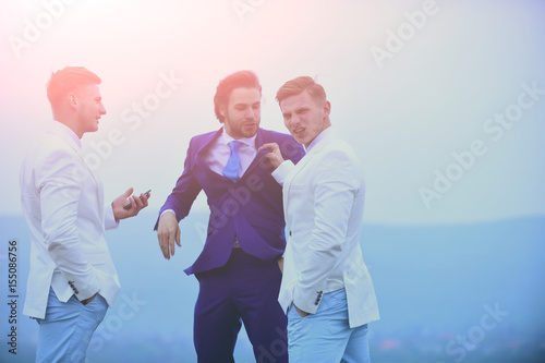 communication, group of business people fighting on blue sky, conflict photo