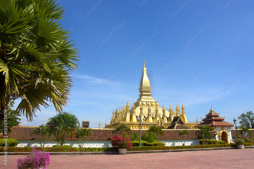 Buddhist  temple  Pha That Luang with Lying Buddha  in Vientiane in Laos.
