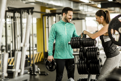 Woman and trainer in the gym