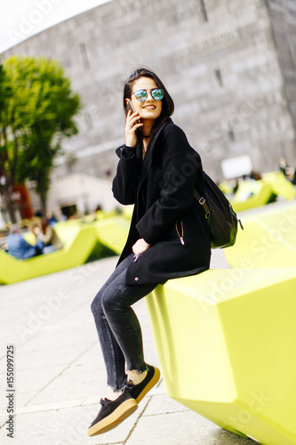 Young woman sitting in the ...