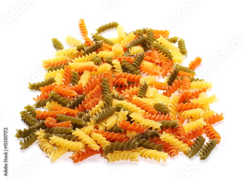 Colorful Italian spiral shaped pasta, macaroni, isolated on white background