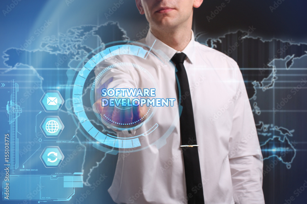 Business, Technology, Internet and network concept. Young businessman working on a virtual screen of the future and sees the inscription: Software development Business, Technology, Internet and network concept. Young businessman working on a virtual screen of the future and sees the inscription: Software development