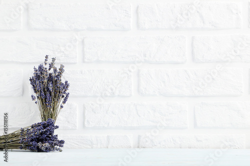 Fototapeta Naklejka Na Ścianę i Meble -  Bunch of lavender flowers on the brick wall background