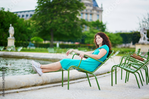 Beautiful young woman relaxing in Parisian Tuileries park © Ekaterina Pokrovsky