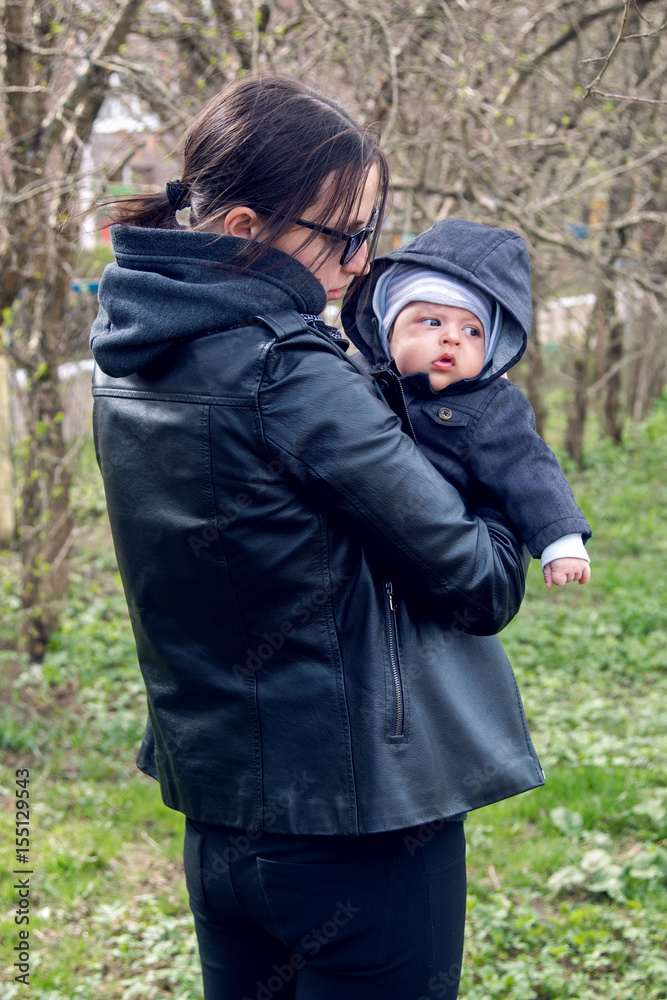 mother and son in the Park in a leather jacket mother and son in the Park in a leather jacket