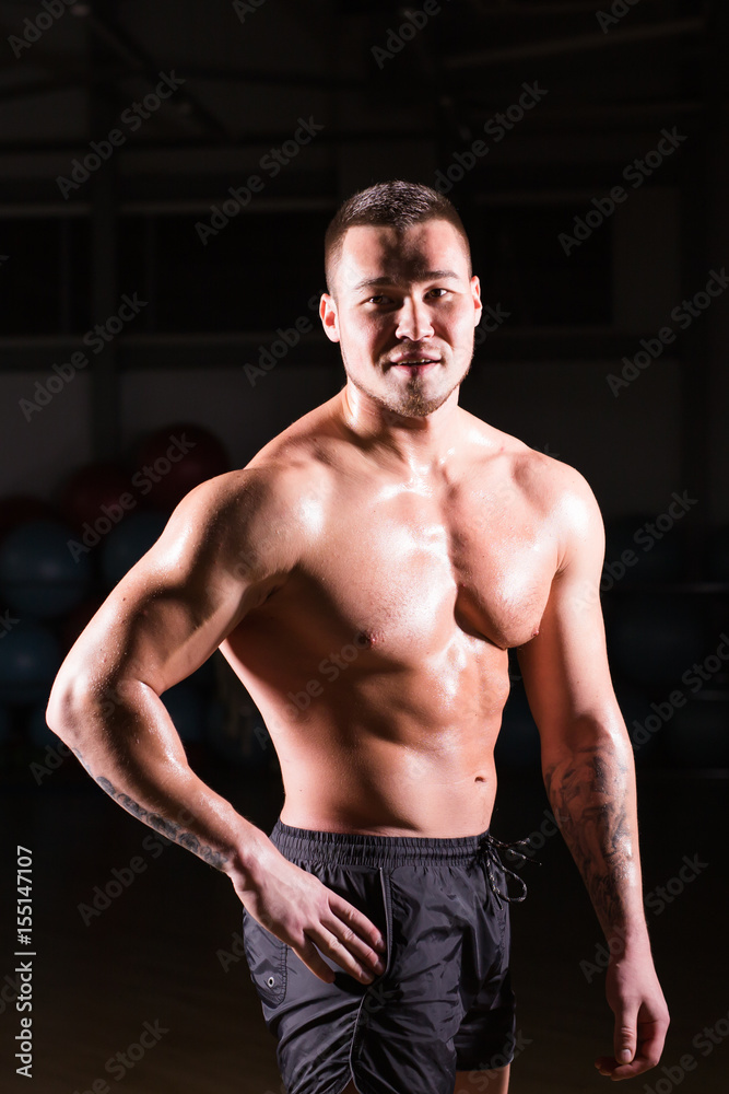 Fototapeta premium Strong Athletic Man Fitness Model Torso showing six pack abs