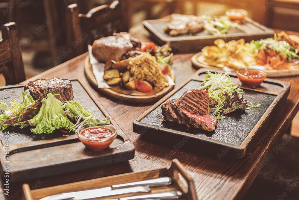 Assortment of hearty dishes served in pub Assortment of hearty dishes served in pub