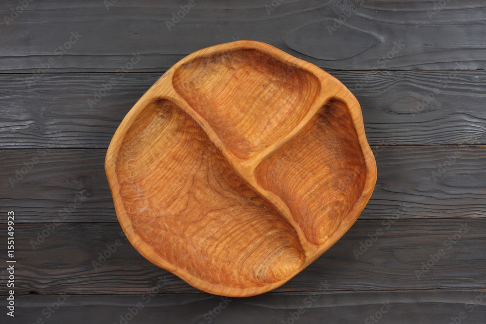 empty wooden plate with red cloth on dark wooden background. with copy space. top view empty wooden plate with red cloth on dark wooden background. with copy space. top view