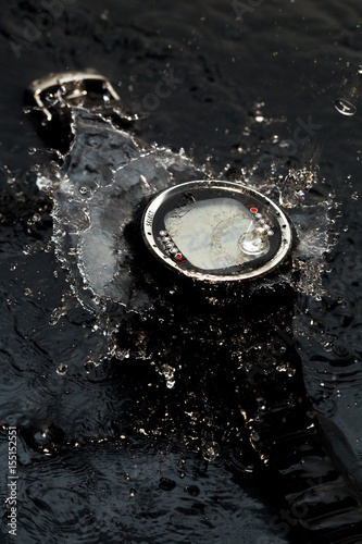 Watches for scuba diving in streams of water on a black background, studio light photo