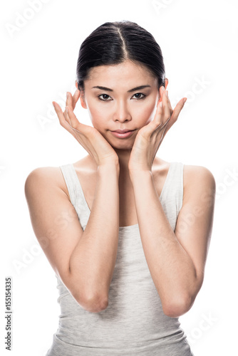 Portrait of Asian young woman looking at camera with an intelligent facial expression