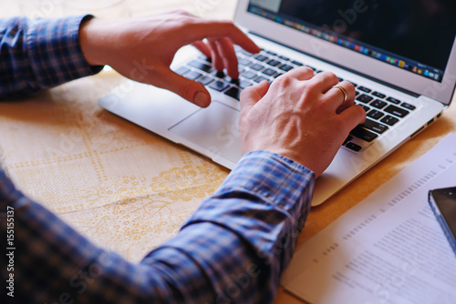 Closeup of businessman is keyboarding on portable net-book