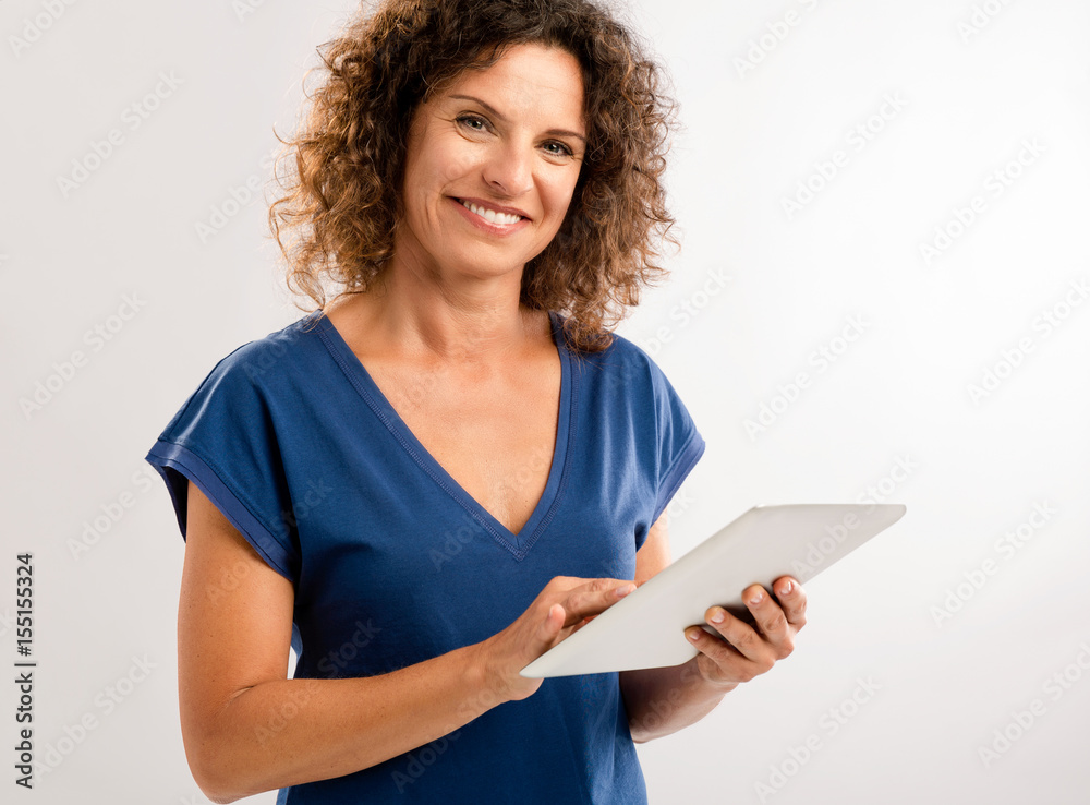 Happy woman working with a tablet Happy woman working with a tablet
