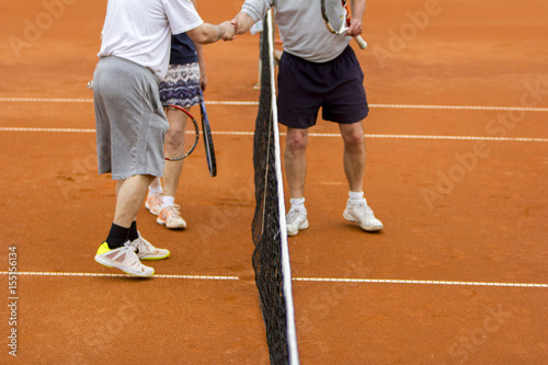 Tennis players shake hands after the tennis match © smuki