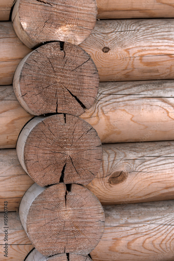 The wall of a wooden house from calibrated logs The wall of a wooden house from calibrated logs
