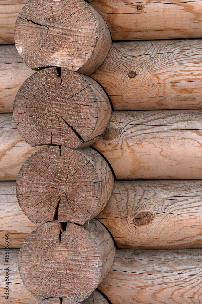The wall of a wooden house from calibrated logs The wall of a wooden house from calibrated logs