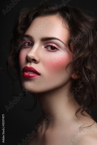 Vintage style portrait of young beautiful girl with stylish make-up