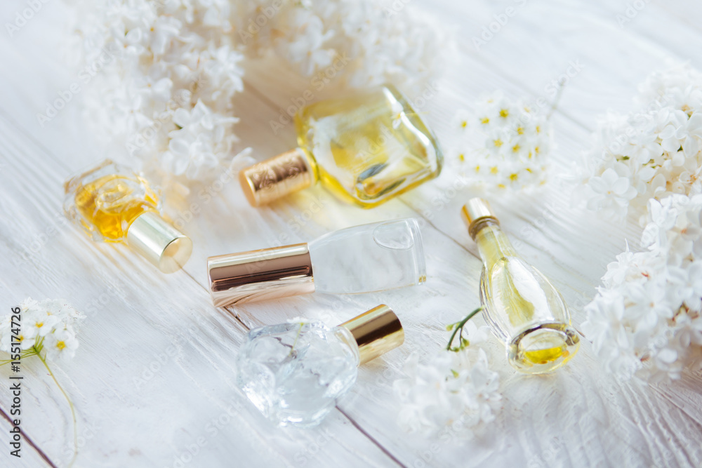 Bottles of perfume with flowers