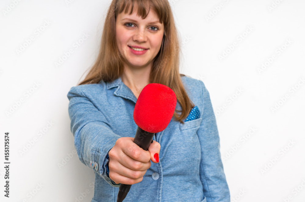 Female reporter with red microphone making interview Female reporter with red microphone making interview