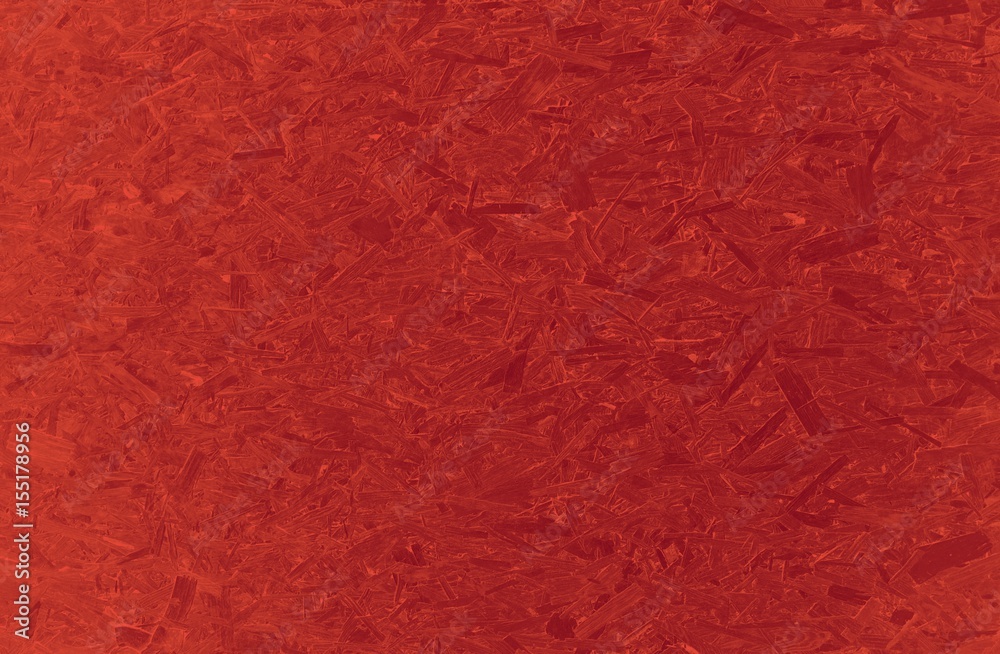 Red textured wooden pressed particle chip board texture background Red textured wooden pressed particle chip board texture background