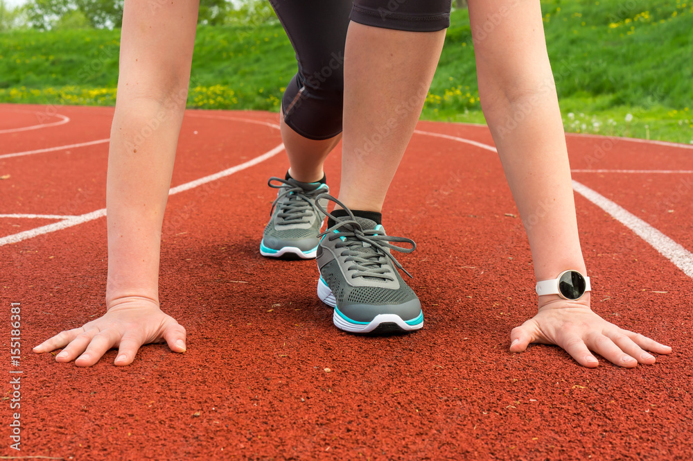 Athlete woman at starting line ready to run Athlete woman at starting line ready to run