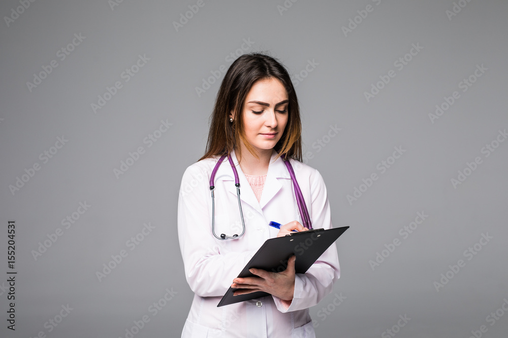 woman doctor or nurse with clipboard with blank paper isolated on grey background