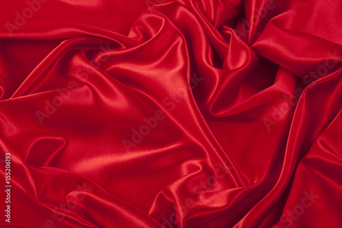 Red satin fabric background.