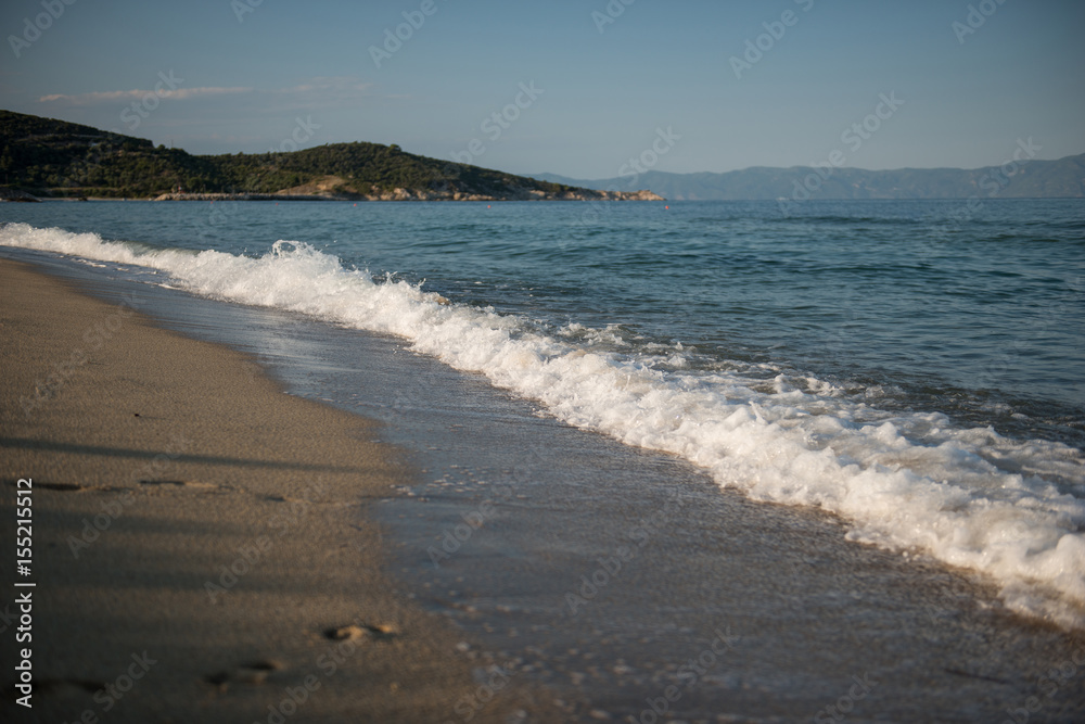 Beach view, waves, sand and blue sky