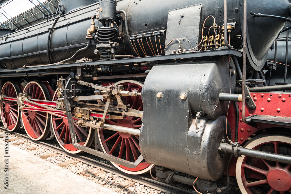 Steam locomotive standing on the platform of the station