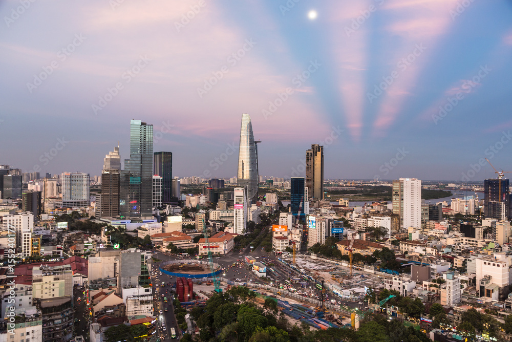 HO CHI MINH CITY, VIETNAM - APRIL 9, 2017: The sun sets over the Ho Chi Minh City skyline that mix the colonial and business district in Vietnam largest city, formerly named Saigon.