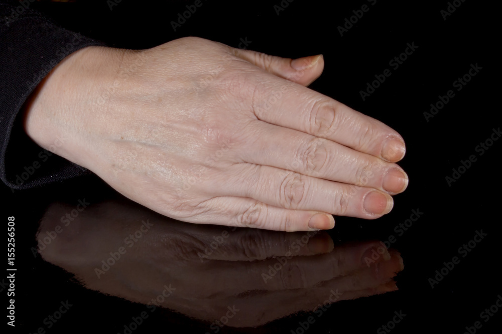 Female hand and its reflection Female hand and its reflection