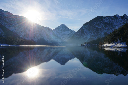 Winter mountain reflections in Plan See, Austria