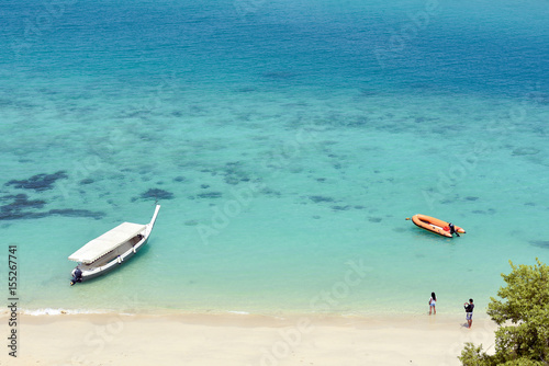 Aerial view of sandy beach with tourists swimming in beautiful clear sea water of the Sumilon island beach landing near Oslob Cebu Philippines. - Boost up color Processing. photo