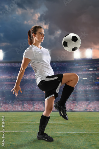 Female Soccer Player Dribbling Ball © R. Gino Santa Maria