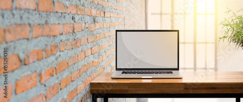 laptop on wooden desk