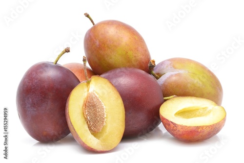 fresh plums on a white background