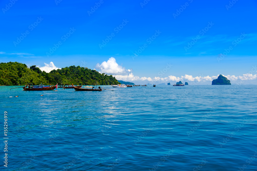 Many tourists visit the sea in Thailand in the summer to dive.