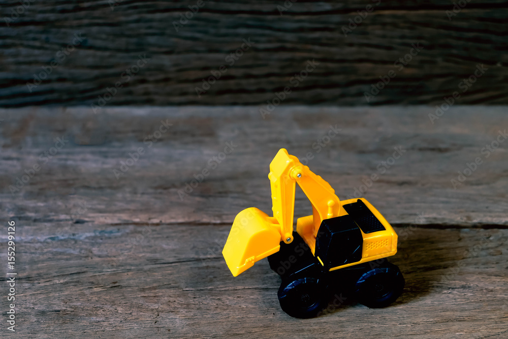 Obraz premium tractor toy on wood background