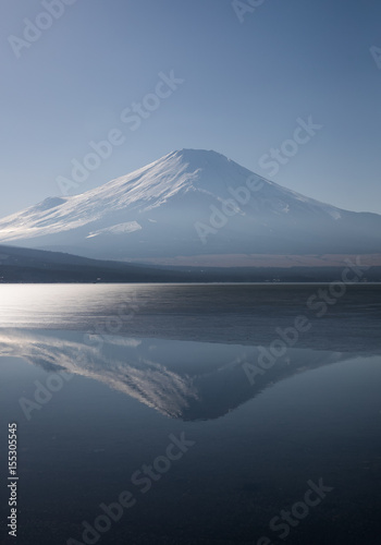 View of Yamanaka ice lake and Mount Fuji with reflection at afternoon in winter season