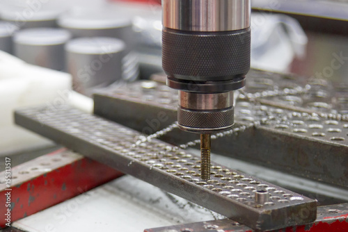 Tapping machine and plate of hole