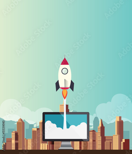 Rocketship on computer for startup media.