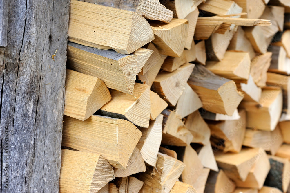 Pile of firewood. Preparation of firewood for the winter. Background Pile of firewood. Preparation of firewood for the winter. Background