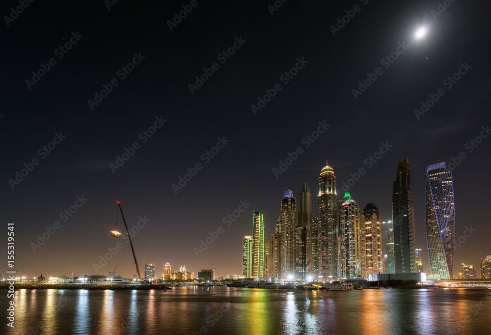 Dubai Marina waterfront in moonlight. May 2017
