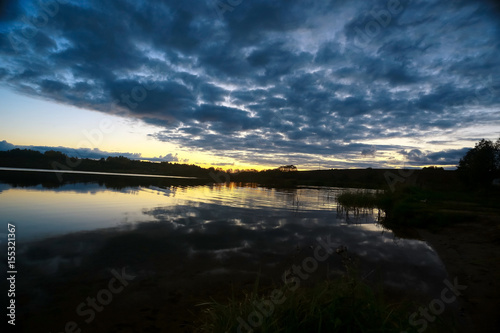 Fototapeta Naklejka Na Ścianę i Meble -  Beautiful sunset on the lake shore