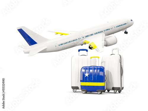 Luggage with flag of curacao. Three bags with airplane © Mikhail Mishchenko
