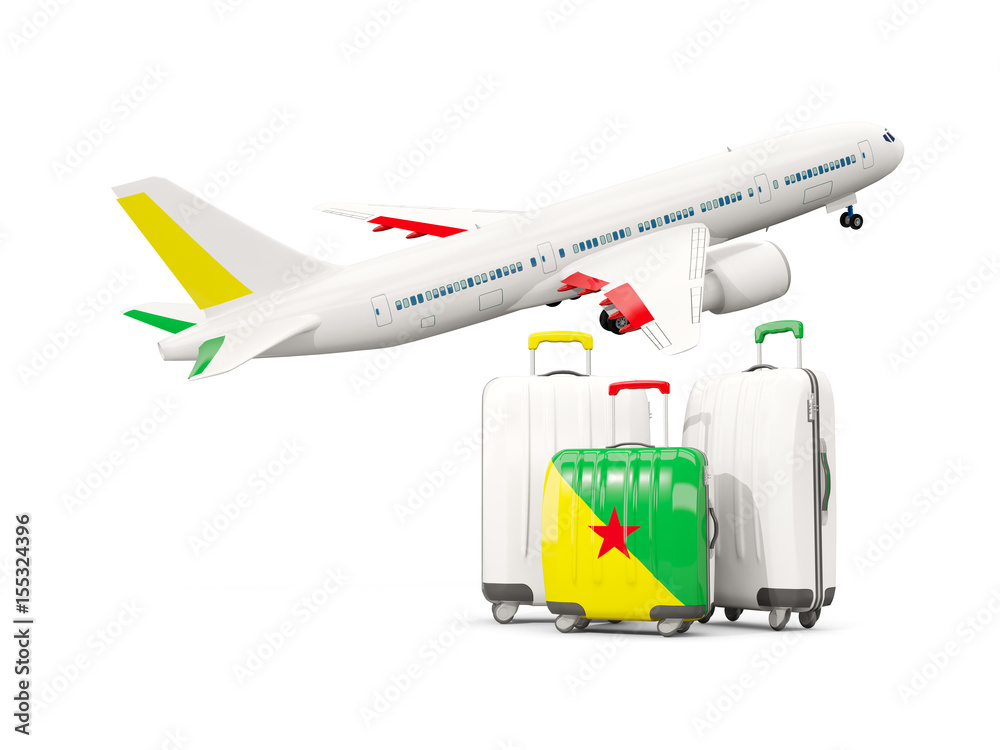 Luggage with flag of french guiana. Three bags with airplane