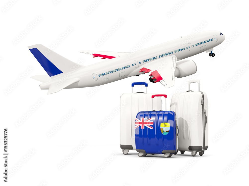 Luggage with flag of saint helena. Three bags with airplane