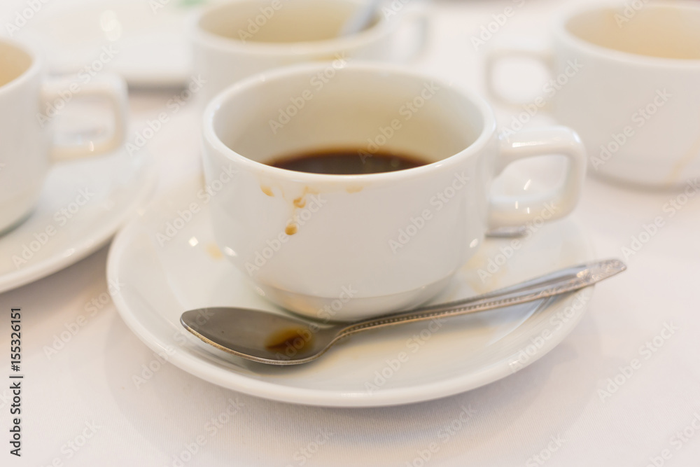 Soft focus and blurred photo of dirty used coffee cups after finished coffee break time. Soft focus and blurred photo of dirty used coffee cups after finished coffee break time.
